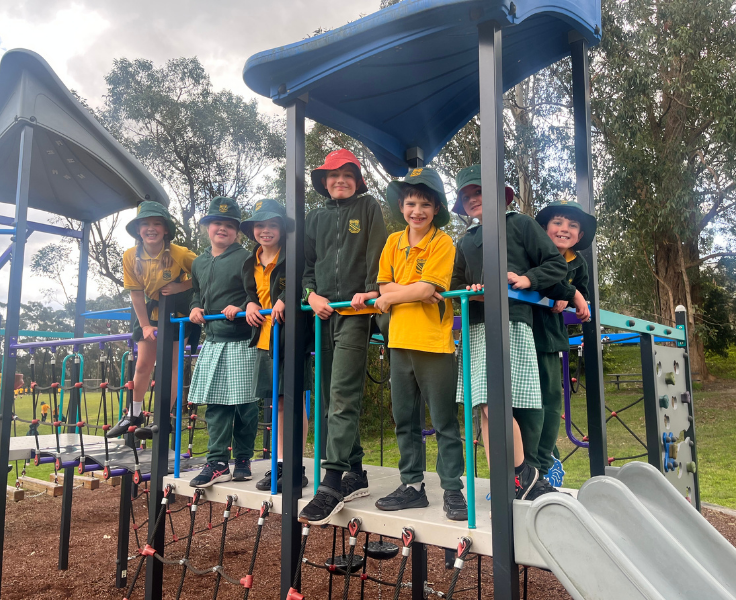 Students on play equipment